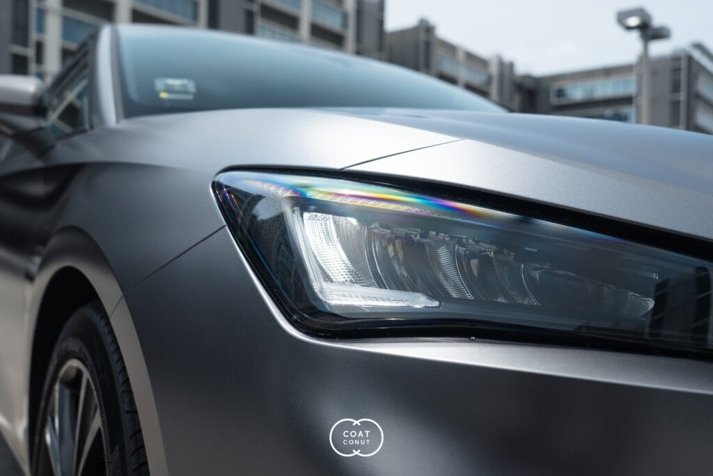 SEAT Leon in a matte grey wrap, headlight and bonnet close-up